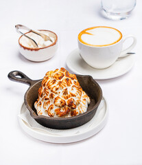 Poster - meringue cake with cappuccino on the table