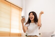 © Jarun - Happy woman from online media via smartphone.