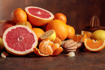 Wall Mural - Citrus fruits on a old brown table.