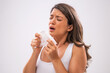© djoronimo - Portrait of adult woman who is sneezing.