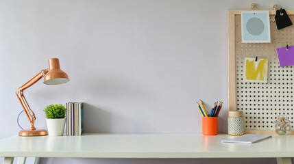 Poster - Minimalist home office desk with copy space on a white table against a plain wall