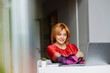 © Westend61 - Businesswoman using laptop at home