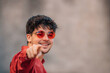 © carballo - smiling young man in sunglasses on the street pointing