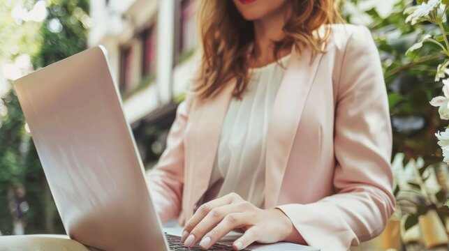Businesswoman typing on laptop with space for text