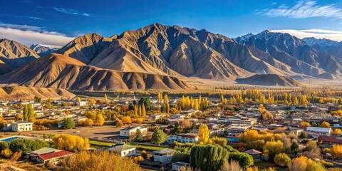 Poster - Small Kyrgyz town Balykchy cityscape with massive mountain ridge in sunny autumn afternoon, Balykchy, Kyrgyzstan, cityscape