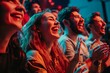 © Oleksandr - Happy audience laughing and applauding at a live show.
