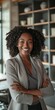 © Andrii Zastrozhnov - A beautiful, successful businesswoman smiling happily in a modern office setting