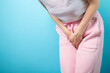 © yta - Urinary incontinence, woman holding crotch, urgent need to urinate, health issue, cystitis.