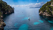 © robertharding - Aerial of a little sailingboat in a bay on the Formentor Peninsula, Mallorca, Balearic islands, Spain, Mediterranean, Europe