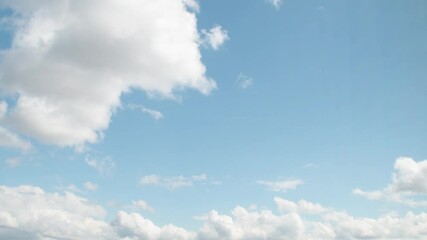 Wall Mural - Close-up of romantic white clouds on a blue sky. Background with empty space for titles.