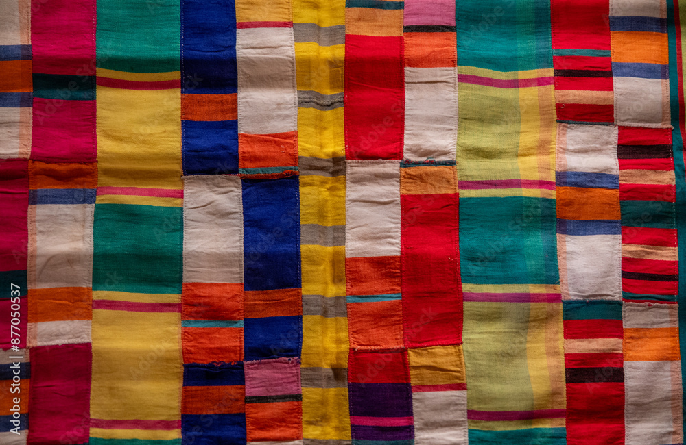 Patches of colorful African fabric making an abstract wallpaper ...
