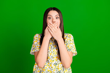 Sticker - Photo portrait of lovely teen lady cover mouth scared dressed stylish flowers print garment isolated on green color background