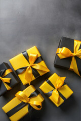 Wall Mural - Festive yellow gift boxes tied with black satin ribbon arranged on the sides of a solid gray background creating copy space, poster for black friday and cyber monday sale promotion