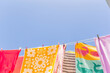 © Austockphoto - Colourful towels and swimmers hanging on washing line
