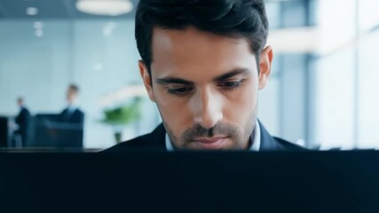 Aufkleber - A man sits in front of a laptop, his eyes focused on the screen. The image is cropped above his head, showing only his focused face and the top of his laptop.