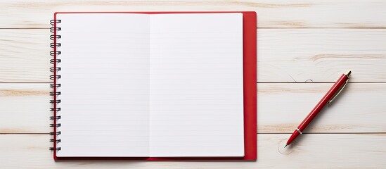 Poster - Business concept with red notepad and open notepad on a white wooden table with a pen, ideal for copy space image.