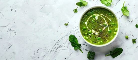Poster - A vibrant spring vegetable soup displayed on white marble with copy space, seen from above.