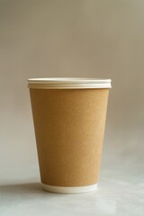 Wall Mural - A cup of coffee sitting on a table with a clean and simple background