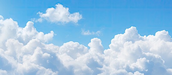 Poster - Soft-focused white clouds against a blue sky background with copy space image.