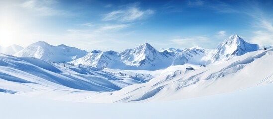 Poster - Breathtaking scenery of snow-covered mountains in bright sunlight with copy space image.