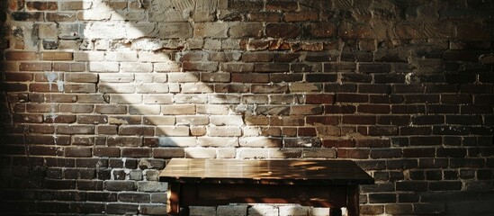 Poster - Contemporary table positioned by a dim brick wall, offering a backdrop for a copy space image.