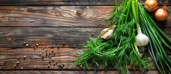 Poster - Top view of green dill and onion on a rustic wooden table with copy space image.