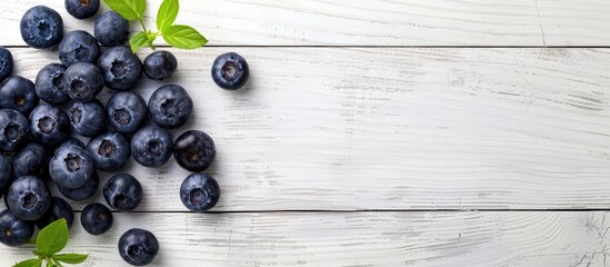Poster - Blueberries on a white wooden surface, symbolizing healthy eating with antioxidants. Ideal for website or banner design with ample copy space image.