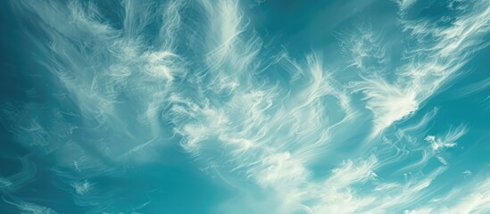 Aufkleber - A serene cloudscape with white wispy clouds against a blue sky, ideal as a background image for design projects with copy space. Conveys a sense of hope and peace, evoking a celestial theme.