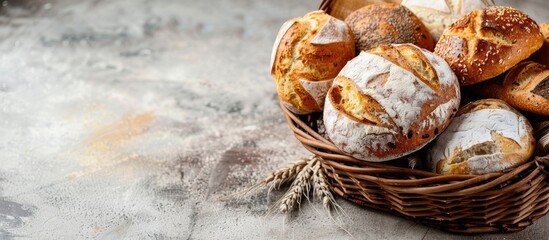 Poster - Composition of various types of bread in a wicker basket with copy space image.