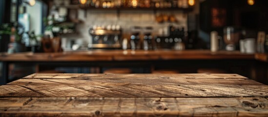 Poster - Wooden table available for product display or montage against a blurred coffee shop background, ideal as a copy space image.