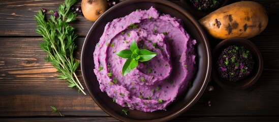 Poster - Top view of a dish with purple sweet potatoes and mashed potatoes on a wooden table, ideal for text placement in a vegan and healthy fruit concept with copy space image.