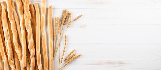 Poster - Top view of grissini, a traditional Italian snack, on a white wooden table with copy space image available.