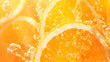 © Maule - Orange slices floating in carbonated orange soda with bubbles
