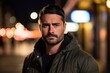 © Stocknterias - Portrait of a handsome man on a city street at night.