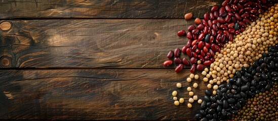 Aufkleber - Flatlay of various beans like red soy black and mung beans on a wooden background with ample copy space image