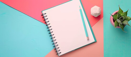 Poster - Minimalism illustrated in an office setting with a blank notebook pencil and cactus on a colorful background top view showcasing a copy space image with a soft pastel filter