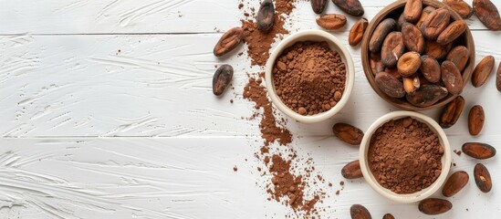 Poster - A flat lay arrangement features cocoa beans chocolate cocoa butter and cocoa powder on a white wooden surface showcasing a top down view with ample free copy space image
