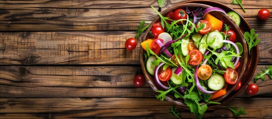 Poster - A fresh vegetable salad in a full bowl on a wooden table with copy space in a top view flat lay image