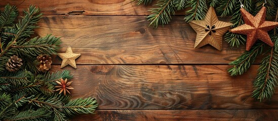 Poster - Wooden background featuring a festive Christmas card adorned with a decorative star fir branches and ample copy space image
