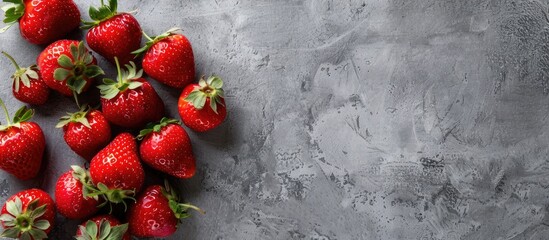 Poster - A gray background showcases fresh strawberries with ample copy space image