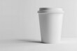 © mediahain.de - A mockup closeup of a plain white coffee cup, positioned on a white background, ideal for showcasing logos and branding.