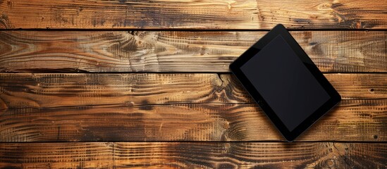 Poster - Digital tablet on a vibrant wooden surface with ample copy space image