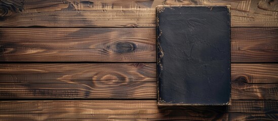 Poster - Vintage book displayed on a wooden surface with copy space image