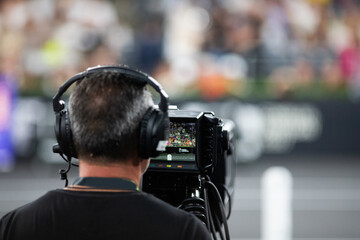 Wall Mural - cameraman silhouette filming during event