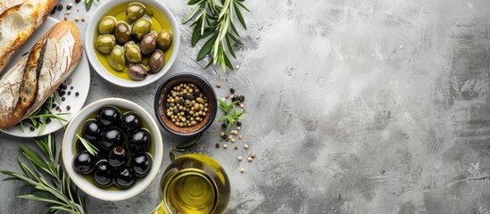 Aufkleber - Light gray background with bowls of green and black olives olive oil artisan bread and Mediterranean food with copy space image