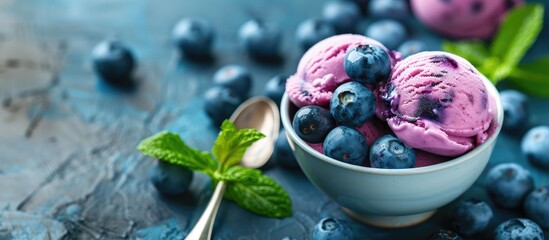 Aufkleber - Delicious dairy free blueberry ice cream dessert topped with fresh organic blueberries and mint ideal for a healthy vegetarian or vegan diet with copy space image
