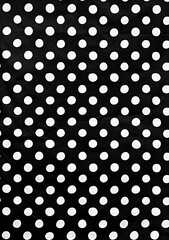 Poster - Black and white polka dot pattern on a black background, top view. In the style of an abstract expressionist painting.