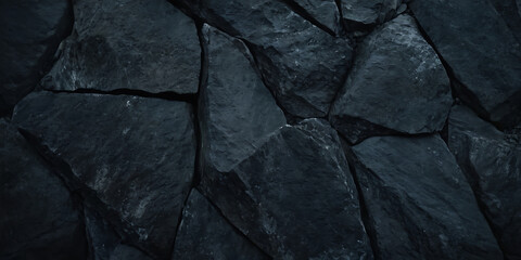 Wall Mural - close-up texture of dark, rough, jagged rocks. ideal for nature, geology, or construction-themed pro