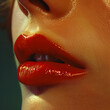 © Kakabe - Close-up of a woman's glossy red lips with a natural skin texture, perfect for makeup and beauty themes.
