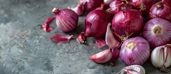 Wall Mural - Market fresh red onions with garlic shown in a copy space image